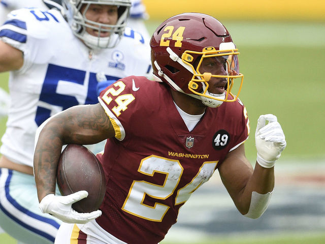 LANDOVER, MARYLAND - OCTOBER 25: Antonio Gibson #24 of the Washington Football Team runs with the ball against the Dallas Cowboys during the first half at FedExField on October 25, 2020 in Landover, Maryland.