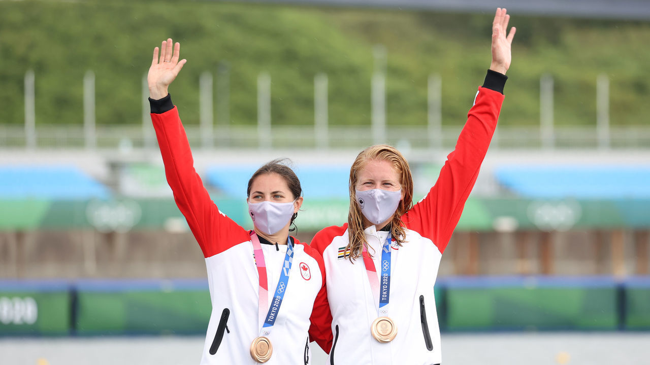 TOKYO, JAPAN - AUGUST 07: Bronze medalists Katie Vincent and Laurence Vincent-Lapointe of Team Canada celebrate at the medal ceremony following the Women's Canoe Double 500m Final A on day fifteen of the Tokyo 2020 Olympic Games at Sea Forest Waterway on August 07, 2021 in Tokyo, Japan.