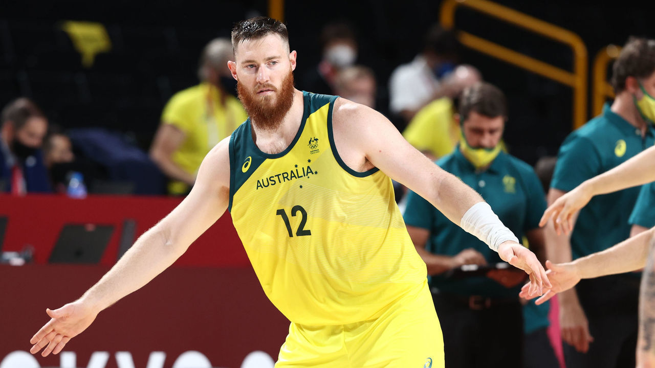 TOKYO, JAPAN - JULY 25: Aron Baynes #12 of the Australia Men's National Team high fives his teammates during the 2020 Tokyo Olympics on July 25, 2021 at Saitama Super Arena in Tokyo, Japan. Mandatory Copyright Notice: Copyright 2021 NBAE