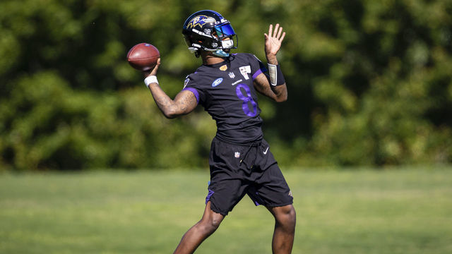 OWINGS MILLS, MD - JUNE 16: Lamar Jackson #8 of the Baltimore Ravens throws the ball during mandatory minicamp at Under Armour Performance Center on June 16, 2021 in Owings Mills, Maryland.