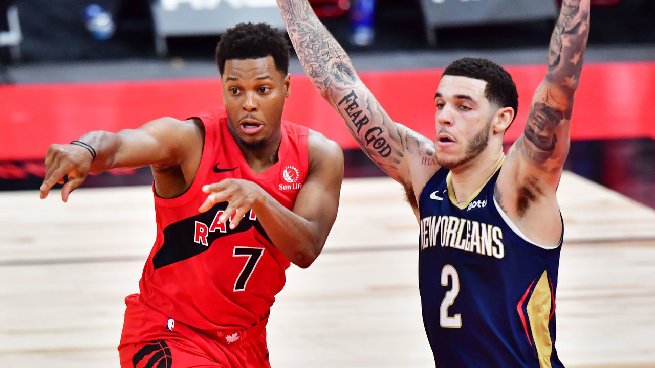 TAMPA, FLORIDA - DECEMBER 23: Kyle Lowry #7 of the Toronto Raptors passes the ball against Lonzo Ball #2 of the New Orleans Pelicans during the second half at Amalie Arena on December 23, 2020 in Tampa, Florida.