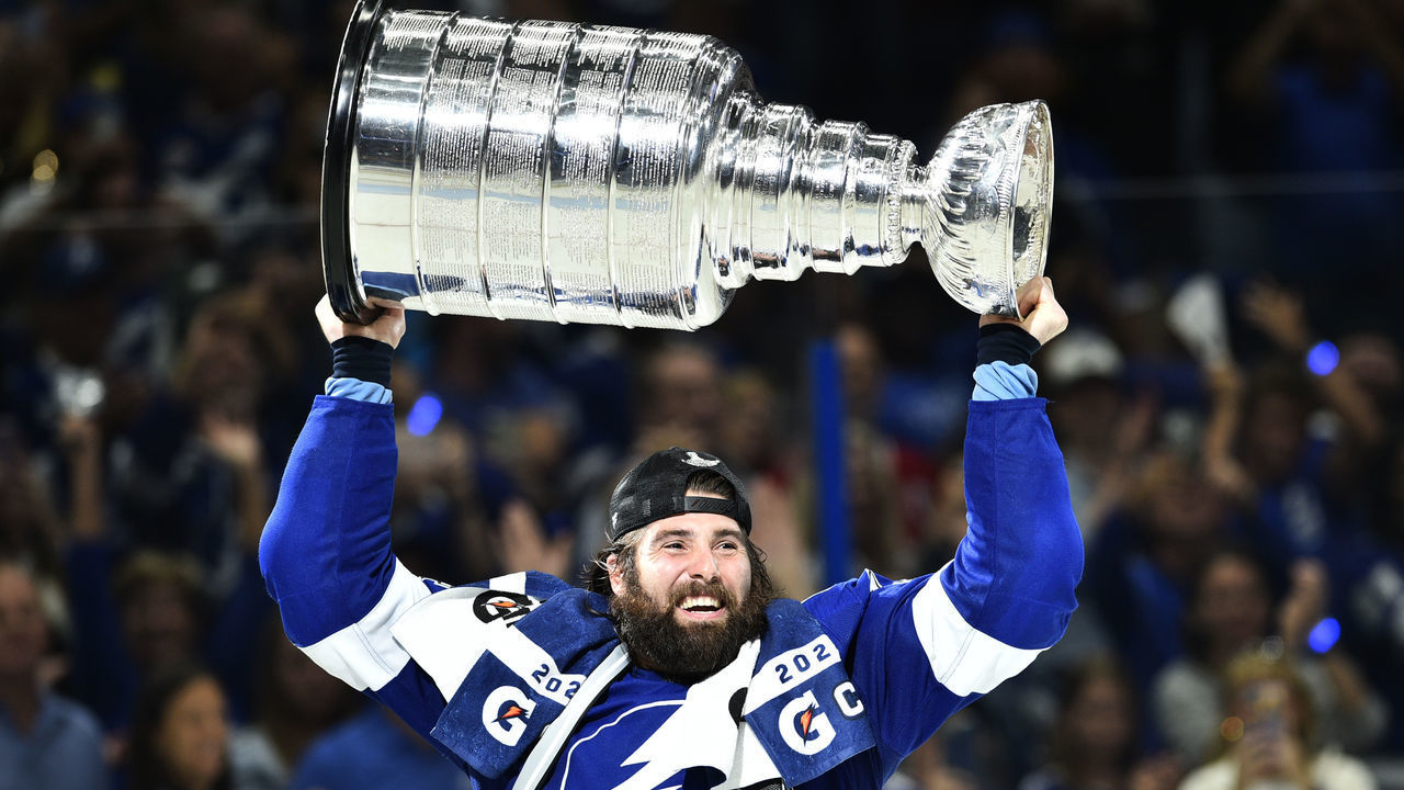 TAMPA, FLORIDA - JULY 07: Pat Maroon #14 of the Tampa Bay Lightning hoists the Stanley Cup after their 1-0 win in Game Five of the 2021 Stanley Cup Final to win the series four games to one against the Montreal Canadiens at Amalie Arena on July 07, 2021 in Tampa, Florida.