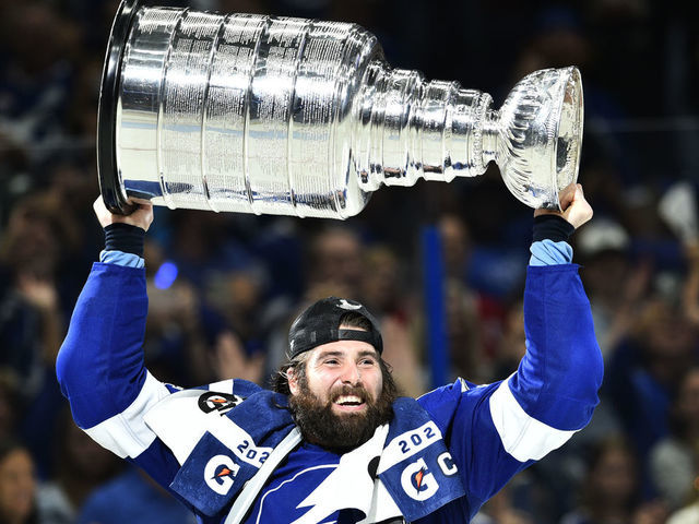 TAMPA, FLORIDA - JULY 07: Pat Maroon #14 of the Tampa Bay Lightning hoists the Stanley Cup after their 1-0 win in Game Five of the 2021 Stanley Cup Final to win the series four games to one against the Montreal Canadiens at Amalie Arena on July 07, 2021 in Tampa, Florida.