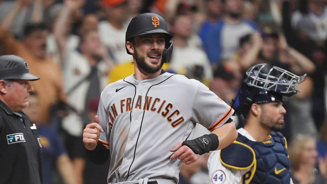 MILWAUKEE, WISCONSIN - AUGUST 07: Kris Byrant #23 of the San Francisco Giants scores in the ninth inning against the San Francisco Giants at American Family Field on August 07, 2021 in Milwaukee, Wisconsin.