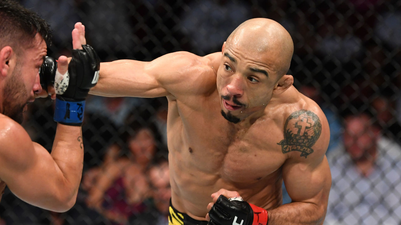 HOUSTON, TEXAS - AUGUST 07: (R-L) Jose Aldo of Brazil punches Pedro Munhoz of Brazil in their bantamweight bout during the UFC 265 event at Toyota Center on August 07, 2021 in Houston, Texas.