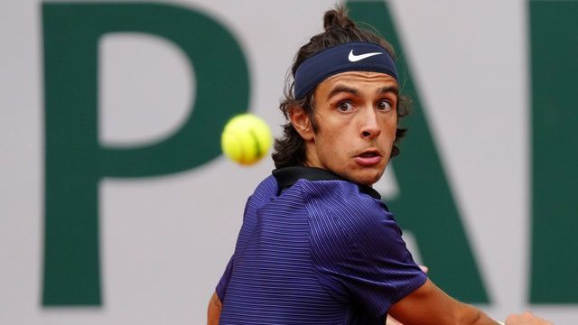 Lorenzo Musetti of Italy hits a return during the men's singles fourth round match between Novak Djokovic of Serbia and Lorenzo Musetti of Italy at the French Open tennis tournament at Roland Garros in Paris, France, June 7, 2021.