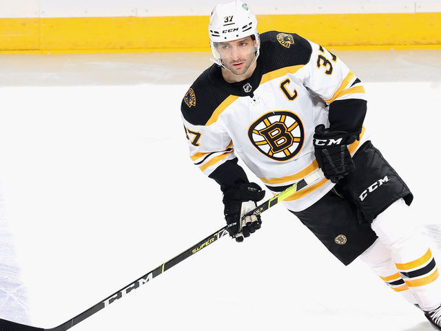 NEWARK, NEW JERSEY - MAY 04: Patrice Bergeron #37 of the Boston Bruins skates against the New Jersey Devils at the Prudential Center on May 04, 2021 in Newark, New Jersey.