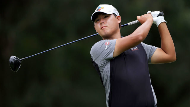 MEMPHIS, TENNESSEE - AUGUST 06: Si Woo Kim of South Korea plays his shot from the fifth tee during the second round of the FedEx St. Jude Invitational at TPC Southwind on August 06, 2021 in Memphis, Tennessee.