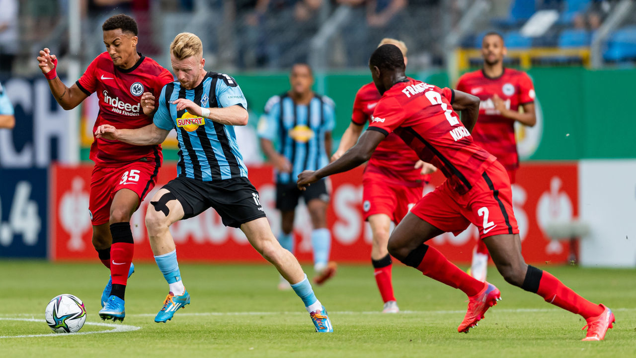 MANNHEIM, GERMANY - AUGUST 08: Tuta of Frankfurt in action against Dominik Martinovic of Waldhof Mannheim during the DFB Cup first round match between Waldhof Mannheim and Eintracht Frankfurt at Carl-Benz-Stadion on August 08, 2021 in Mannheim, Germany.