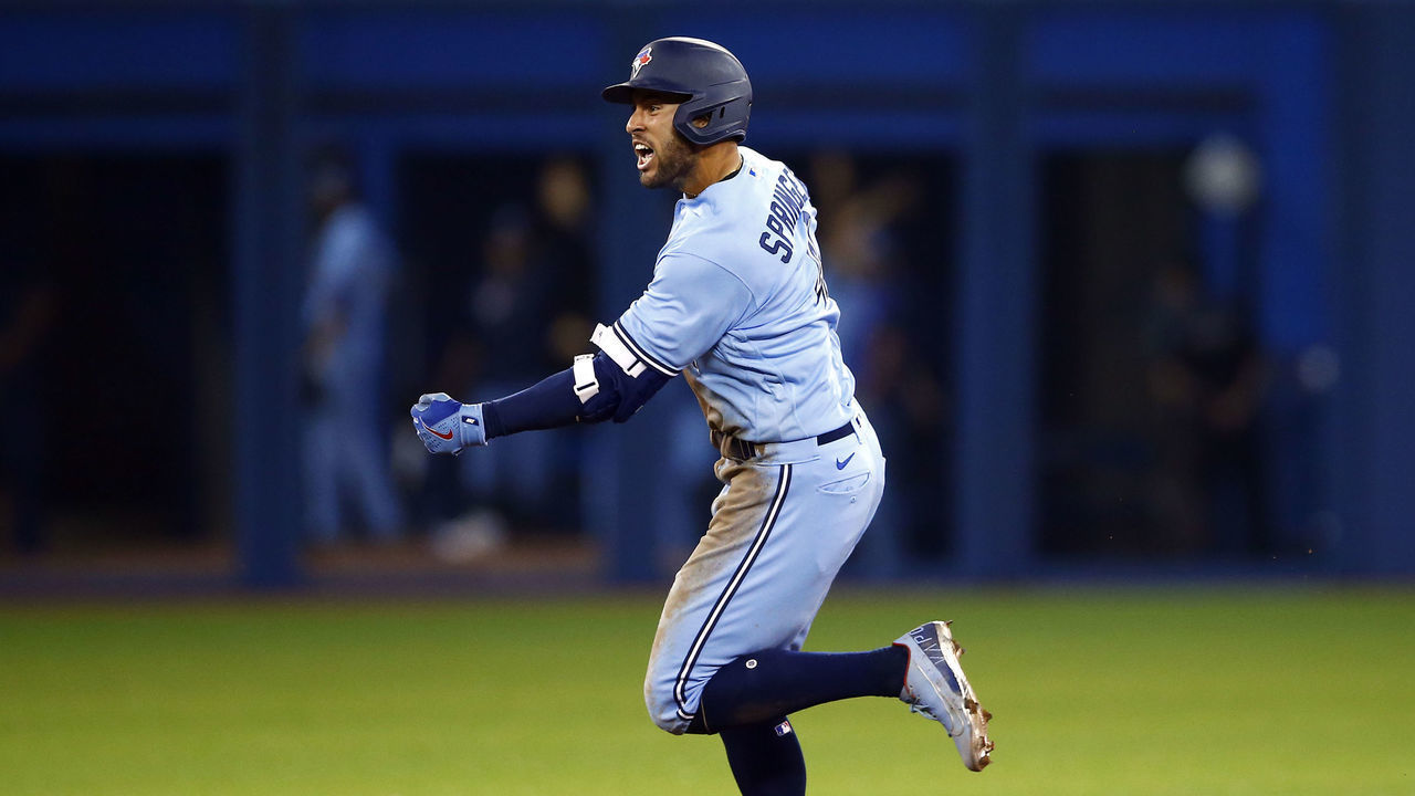 TORONTO, ON - AUGUST 08: George Springer #4 of the Toronto Blue Jays celebrates his 3-run game winning home run during the eighth inning during a MLB game against the Boston Red Sox at Rogers Centre on August 08, 2021 in Toronto, Canada.