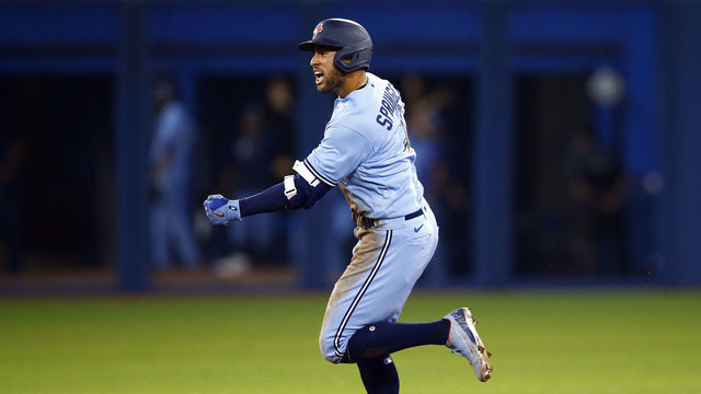 TORONTO, ON - AUGUST 08: George Springer #4 of the Toronto Blue Jays celebrates his 3-run game winning home run during the eighth inning during a MLB game against the Boston Red Sox at Rogers Centre on August 08, 2021 in Toronto, Canada.