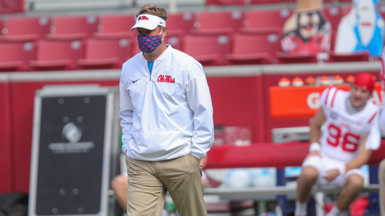 FAYETTEVILLE, AR - OCTOBER 17: Ole Miss head coach Lane Kiffin watches his team warm up before the game between the Ole Miss Rebels and the Arkansas Razorbacks on October 17, 2020 at Donald W. Reynolds Razorback Stadium in Fayetteville, AR.