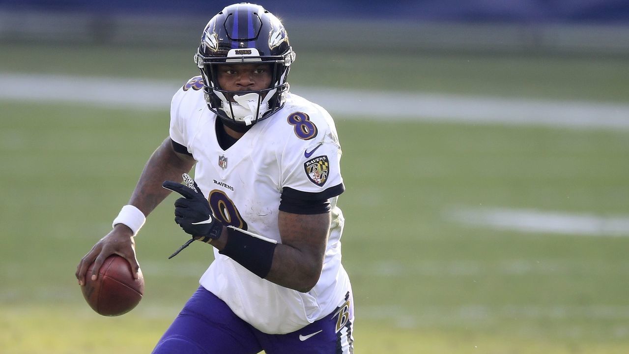 NASHVILLE, TENNESSEE - JANUARY 10: Lamar Jackson #8 of the Baltimore Ravens runs with the ball against the Tennessee Titans in the Wild Card Round of the NFL Playoffs at Nissan Stadium on January 10, 2021 in Nashville, Tennessee.