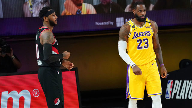 ORLANDO, FL - AUGUST 29: Carmelo Anthony #00 of the Portland Trail Blazers and LeBron James #23 of the Los Angeles Lakers look on during Round One, Game Five of the NBA Playoffs on August 29, 2020 at the AdventHealth Arena at ESPN Wide World Of Sports Complex in Orlando, Florida. NOTE TO USER: User expressly acknowledges and agrees that, by downloading and/or using this Photograph, user is consenting to the terms and conditions of the Getty Images License Agreement. Mandatory Copyright Notice: Copyright 2020 NBAE