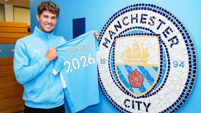 MANCHESTER, ENGLAND - AUGUST 10: John Stones of Manchester City signs a contract extension at Manchester City Football Academy on August 10, 2021 in Manchester, England.