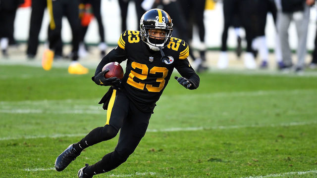 PITTSBURGH, PA - DECEMBER 02: Joe Haden #23 of the Pittsburgh Steelers carries the ball for a touchdown after intercepting a pass during the first quarter against the Baltimore Ravens at Heinz Field on December 1, 2020 in Pittsburgh, Pennsylvania.