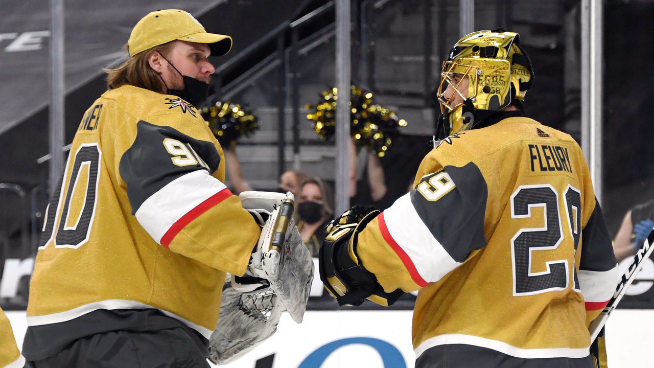 LAS VEGAS, NEVADA - JANUARY 20: Robin Lehner #90 and Marc-Andre Fleury #29 of the Vegas Golden Knights celebrate on the ice after the team's 5-2 victory over the Arizona Coyotes at T-Mobile Arena on January 20, 2021 in Las Vegas, Nevada.