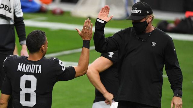 LAS VEGAS, NEVADA - DECEMBER 13: Las Vegas Raiders head coach Jon Gruden high-fives Marcus Mariota #8 during warmups against the Indianapolis Colts at Allegiant Stadium on December 13, 2020 in Las Vegas, Nevada.