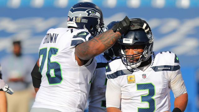 ORCHARD PARK, NEW YORK - NOVEMBER 08: Duane Brown #76 of the Seattle Seahawks congratulates Russell Wilson #3 of the Seattle Seahawks on his touchdown during the first half against the Buffalo Bills at Bills Stadium on November 08, 2020 in Orchard Park, New York.