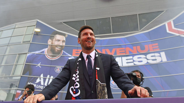 PARIS, FRANCE - AUGUST 11: Lionel Messi celebrates with fans after his press conference of Paris Saint-Germain at Parc des Princes on August 11, 2021 in Paris, France.
