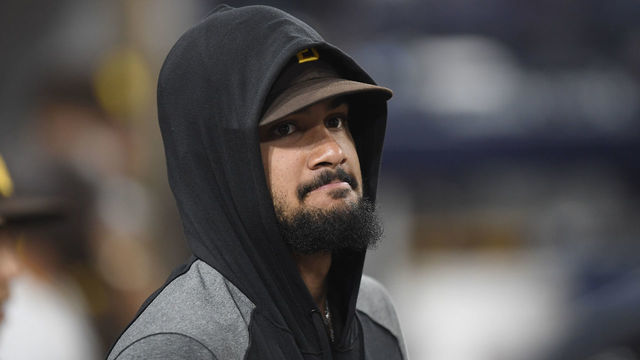 SAN DIEGO, CA - AUGUST 9: Fernando Tatis Jr. #23 of the San Diego Padres looks on from the dugout during the eighth inning of a baseball game against the Miami Marlins at Petco Park on August 9, 2021 in San Diego, California.