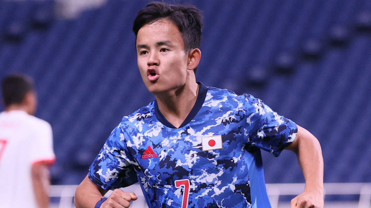 Japan's forward Takefusa Kubo celebrates after scoring the opening goal during the Tokyo 2020 Olympic Games men's group A first round football match between Japan and Mexico at Saitama Stadium in Saitama on July 25, 2021.