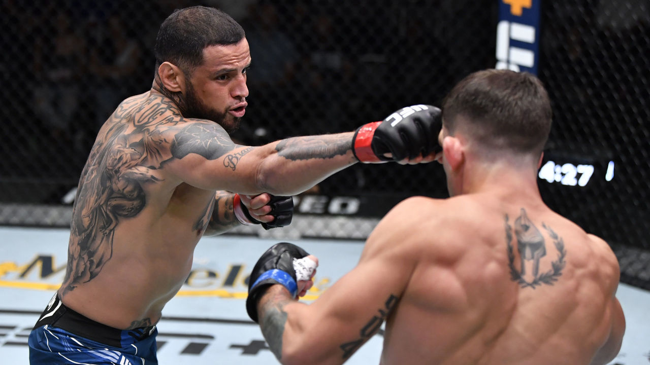 LAS VEGAS, NEVADA - JULY 17: (L-R) Daniel Rodriguez punches Preston Parsons in their welterweight bout during the UFC Fight Night event at UFC APEX on July 17, 2021 in Las Vegas, Nevada.