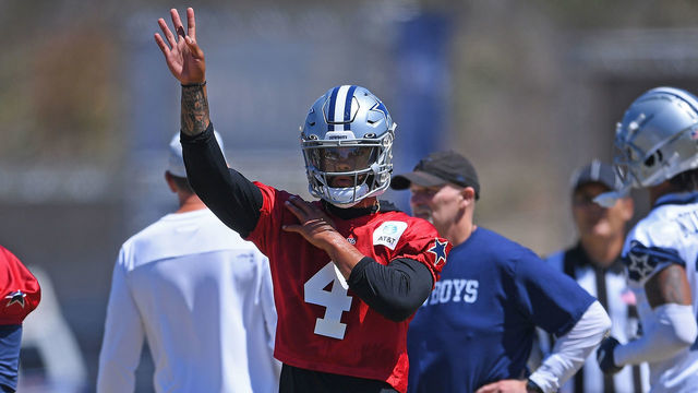 OXNARD, CA - AUGUST 03: Quarterback Dak Prescott #4 of the Dallas Cowboys stretches on the field during practice at River Ridge Complex on August 3, 2021 in Oxnard, California.