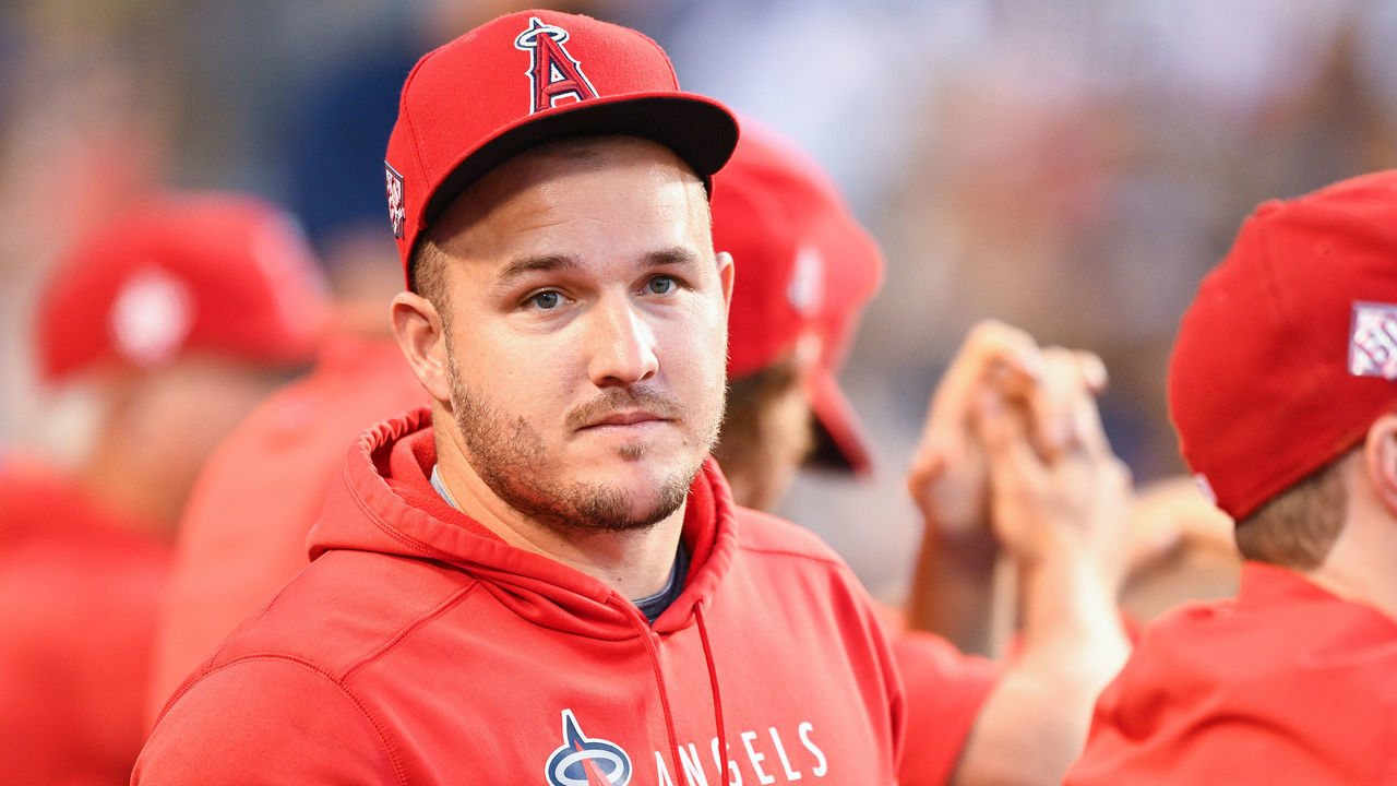 LOS ANGELES, CA - AUGUST 06: Los Angeles Angels center fielder Mike Trout (27) looks on in the dugout during the MLB game between the Los Angeles Angels and the Los Angeles Dodgers on August 6, 2021 at Dodger Stadium in Los Angeles, CA.