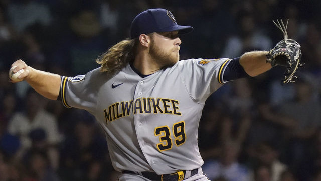 CHICAGO, ILLINOIS - AUGUST 11: Corbin Burnes #39 of the Milwaukee Brewers throws a pitch in the fourth inning against the Chicago Cubs at Wrigley Field on August 11, 2021 in Chicago, Illinois.