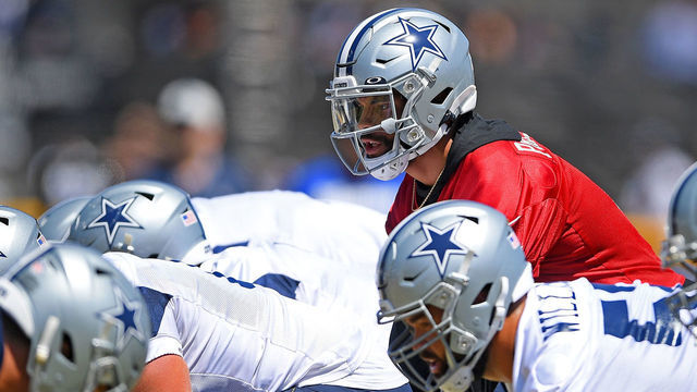 OXNARD, CA - AUGUST 03: Quarterback Dak Prescott #4 of the Dallas Cowboys takes a snap during practice at River Ridge Complex on August 3, 2021 in Oxnard, California.