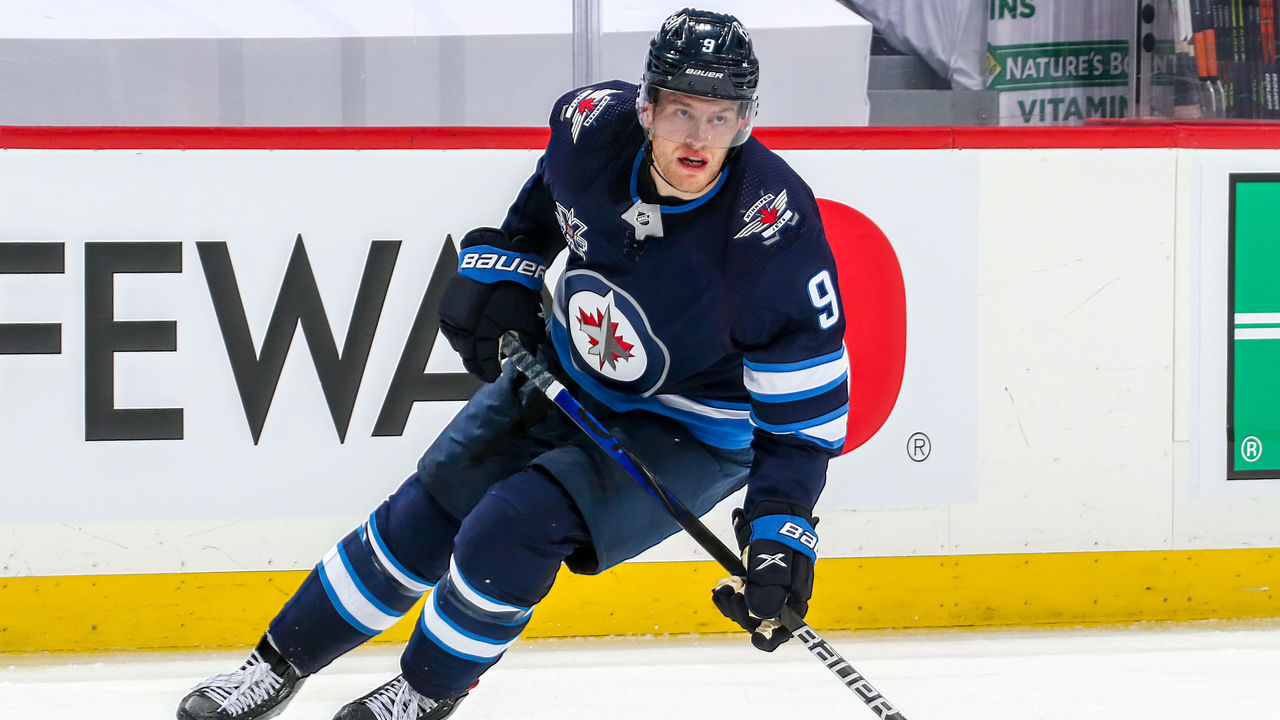 WINNIPEG, MB - MAY 23: Andrew Copp #9 of the Winnipeg Jets keeps an eye on the play during third period action against the Edmonton Oilers in Game Three of the First Round of the 2021 Stanley Cup Playoffs at Bell MTS Place on May 23, 2021 in Winnipeg, Manitoba.
