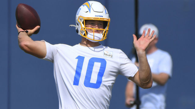 COSTA MESA, CA - JUNE 16: Justin Herbert #10 of the Los Angeles Chargers throws during mandatory minicamp at the Hoag Performance Center on June 16, 2021 in Costa Mesa, California.