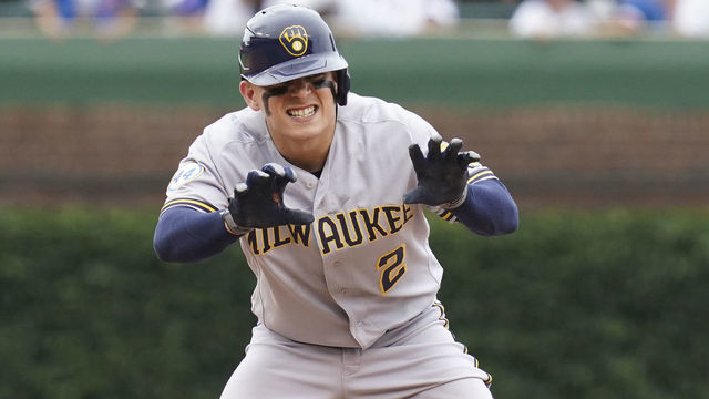 CHICAGO, ILLINOIS - AUGUST 12: Luis Urias #2 of the Milwaukee Brewers reacts following his RBI double during the sixth inning of a game against the Chicago Cubs at Wrigley Field on August 12, 2021 in Chicago, Illinois.