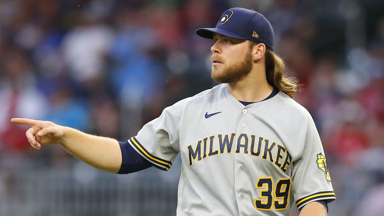 ATLANTA, GA - JULY 30: Corbin Burnes #39 of the Milwaukee Brewers reacts in the first inning of an MLB game against the Atlanta Braves at Truist Park on July 30, 2021 in Atlanta, Georgia.