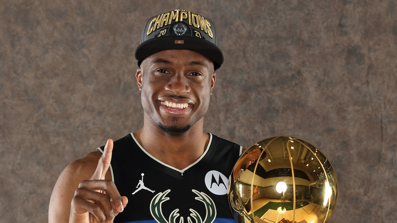 MILWAUKEE, WI - JULY 30: Thanasis Antetokounmpo #43 of the Milwaukee Bucks poses with the Larry O'Brien NBA Championship Trophy at the Froedtert & the Medical College of Wisconsin Sports Science Center on July 30, 2021 in Milwaukee, Wisconsin. Mandatory Copyright Notice: Copyright 2021 NBAE