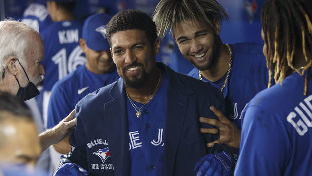 TORONTO, ON - AUGUST 07: Marcus Semien #10 of the Toronto Blue Jays celebrates in the dugout with teammates after hitting a walk-off home run in the seventh inning of Game One of the doubleheader MLB game against the Boston Red Sox at Rogers Centre on August 7, 2021 in Toronto, Ontario.