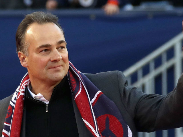 WINNIPEG, MB - OCTOBER 23: Winnipeg Jets alumni Dale Hawerchuk waves to the crowd from the field during the second intermission of the 2016 Tim Hortons NHL Heritage Classic between the Edmonton Oilers and the Winnipeg Jets at Investors Group Field on October 23, 2016 in Winnipeg, Canada.