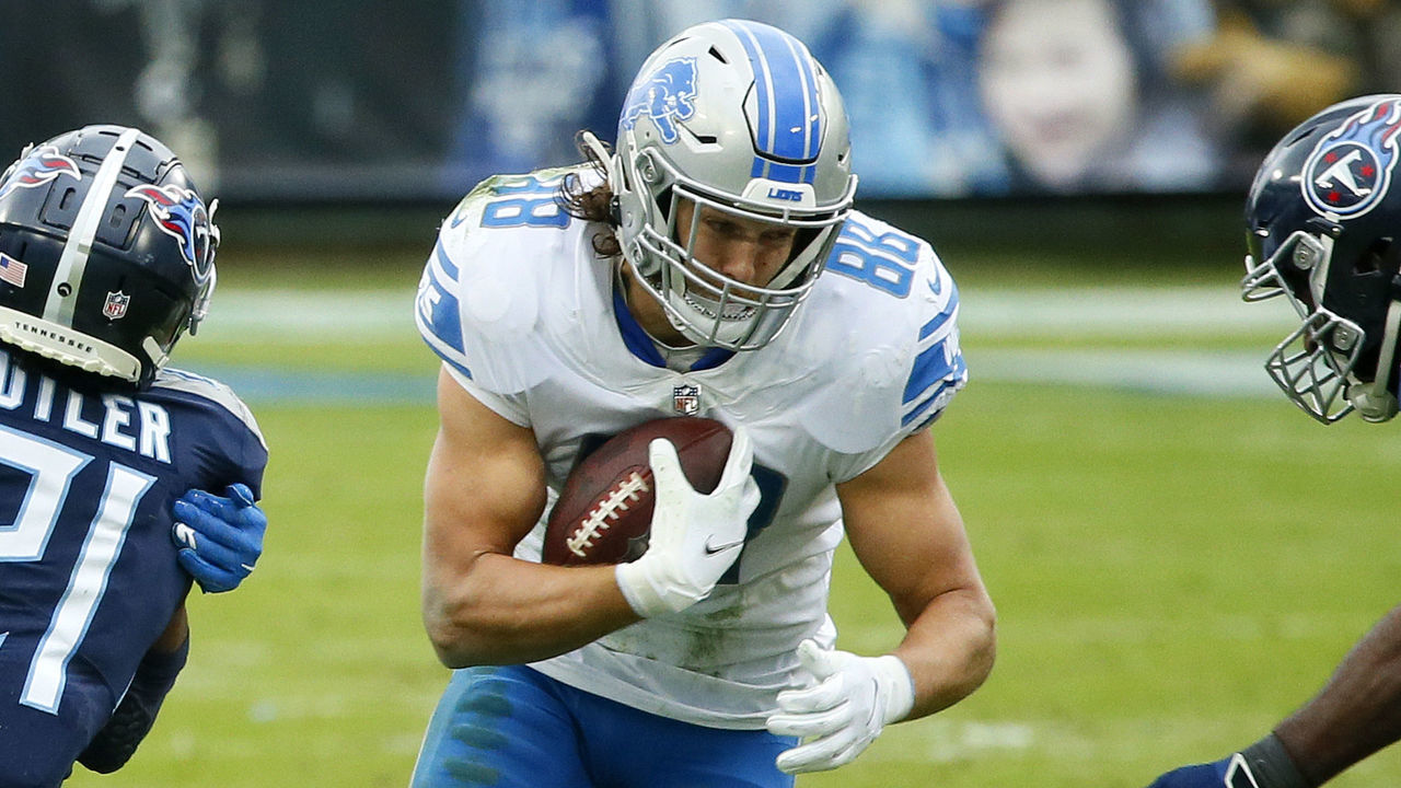 NASHVILLE, TENNESSEE - DECEMBER 20: Tight end T.J. Hockenson #88 of the Detroit Lions carries the football as wide receiver Marvin Jones #11 of the Detroit Lions blocks cornerback Malcolm Butler #21 of the Tennessee Titans during the second quarter of the game at Nissan Stadium on December 20, 2020 in Nashville, Tennessee.