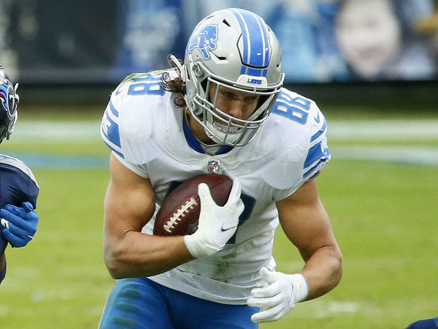 NASHVILLE, TENNESSEE - DECEMBER 20: Tight end T.J. Hockenson #88 of the Detroit Lions carries the football as wide receiver Marvin Jones #11 of the Detroit Lions blocks cornerback Malcolm Butler #21 of the Tennessee Titans during the second quarter of the game at Nissan Stadium on December 20, 2020 in Nashville, Tennessee.