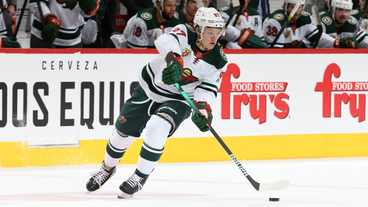 GLENDALE, ARIZONA - APRIL 21: Kirill Kaprizov #97 of the Minnesota Wild skates with the puck against the Arizona Coyotes at Gila River Arena on April 21, 2021 in Glendale, Arizona.