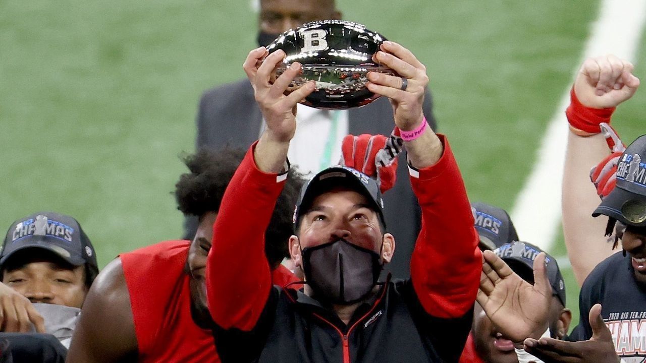 INDIANAPOLIS, INDIANA - DECEMBER 19: Ryan Day the head coach of the Ohio State Buckeyes holds up the championship trophy after the 22-10 win over the Northwestern Wildcats in the Big Ten Championship at Lucas Oil Stadium on December 19, 2020 in Indianapolis, Indiana.