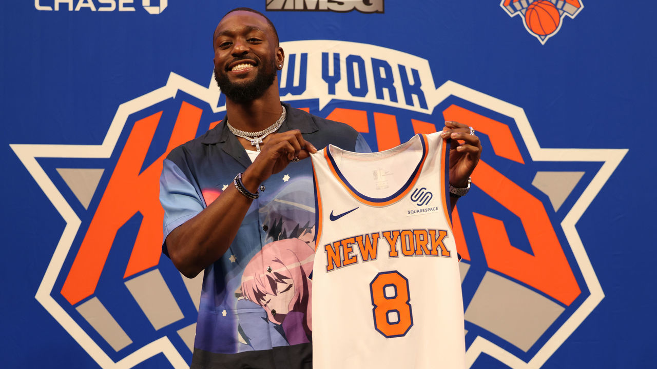 NEW YORK, NEW YORK - AUGUST 17: Kemba Walker #8 of the New York Knicks holds up his jersey after being introduced a press event at Madison Square Garden on August 17, 2021 in New York City.