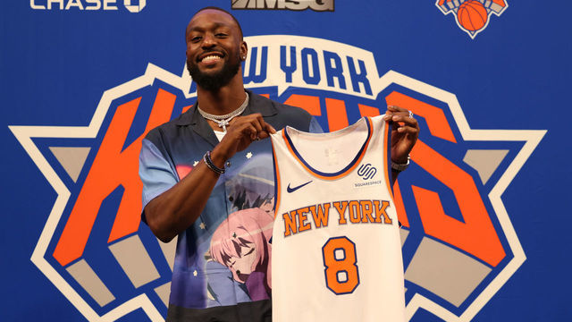NEW YORK, NEW YORK - AUGUST 17: Kemba Walker #8 of the New York Knicks holds up his jersey after being introduced a press event at Madison Square Garden on August 17, 2021 in New York City.