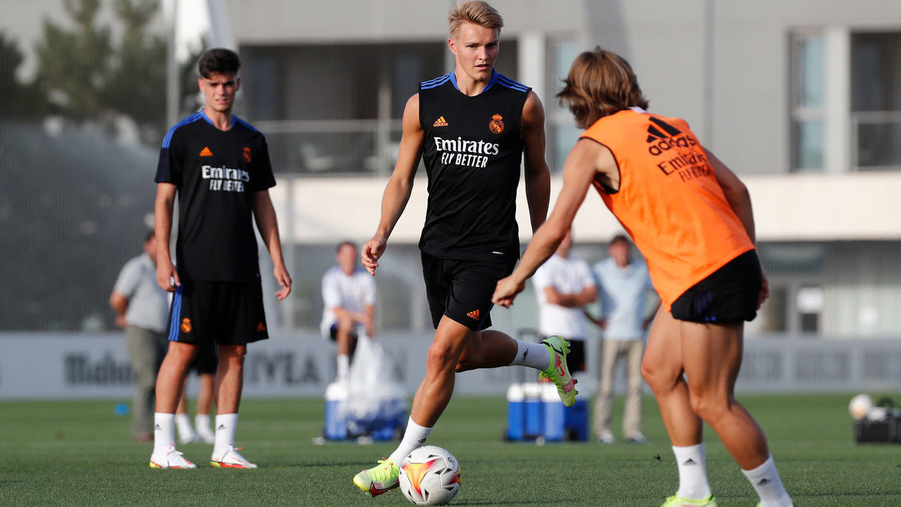 MADRID, SPAIN - AUGUST 13: Luka Modric and Martin Ødegaard both of Real Madrid are training with teammate Miguel Gutiérrez at Valdebebas training ground on August 13, 2021 in Madrid, Spain.