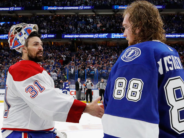 TAMPA, FLORIDA - JULY 07: Carey Price #31 of the Montreal Canadiens and Andrei Vasilevskiy #88 of the Tampa Bay Lightning shake hands following the Lightning's victory over the Montreal Canadiens in Game Five of the 2021 NHL Stanley Cup Final at the Amalie Arena on July 07, 2021 in Tampa, Florida. The Lightning defeated the Canadiens 1-0 to take the series four games to one.