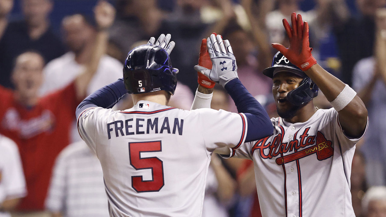 MIAMI, FLORIDA - AUGUST 18: Freddie Freeman #5 of the Atlanta Braves celebrates with Jorge Soler #12 after hitting a two-run home run to hit for the cycle during the sixth inning against the Miami Marlins at loanDepot park on August 18, 2021 in Miami, Florida.
