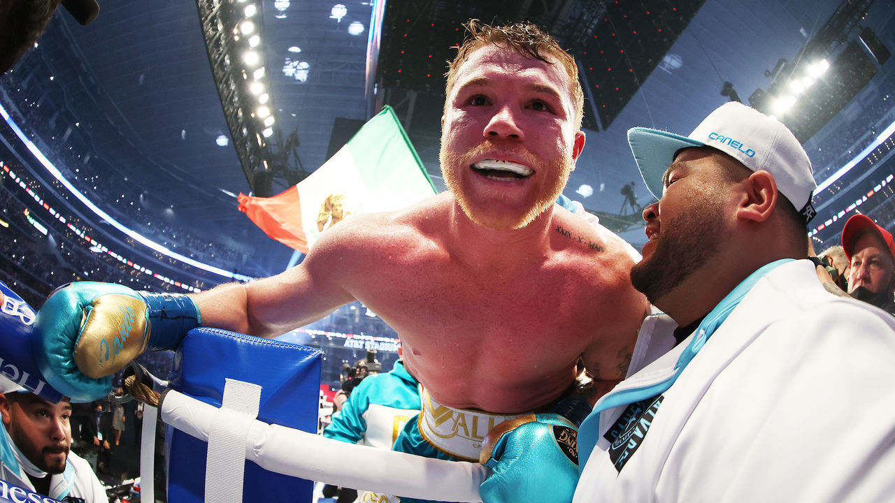 ARLINGTON, TEXAS - MAY 08: Canelo Alvarez celebrates after defeating Billy Joe Saunders who did not answer the bell for the eighth round during their fight for Alvarez's WBC and WBA super middleweight titles and Saunders' WBO super middleweight title at AT&T Stadium on May 08, 2021 in Arlington, Texas.