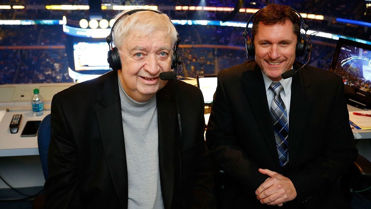 BUFFALO, NY - NOVEMBER 15: Broadcaster and cancer survivor Rick Jeanneret (L) returns alongside Dan Dunleavy (R) to broadcast a portion of the game between the Buffalo Sabres and the Toronto Maple Leafs on November 15, 2014 at the First Niagara Center in Buffalo, New York.