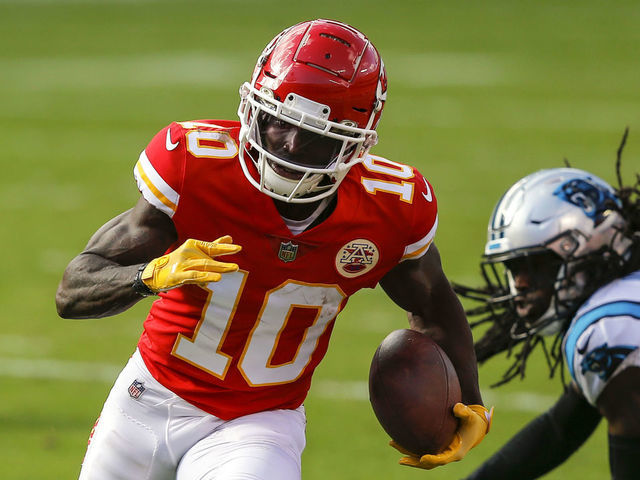 KANSAS CITY, MO - NOVEMBER 08: Tyreek Hill #10 of the Kansas City Chiefs runs past Donte Jackson #26 of the Carolina Panthers on a second quarter pass reception at Arrowhead Stadium on November 8, 2020 in Kansas City, Missouri.